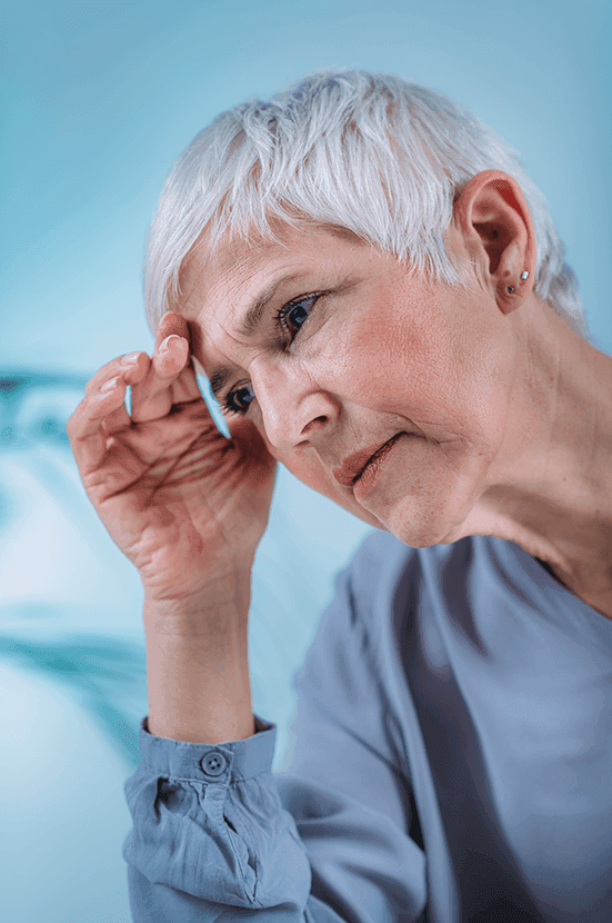Senior woman suffering from vertigo and dizziness